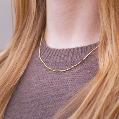 Fin guldkæde med ovale detaljer